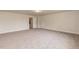 Large bonus room with neutral walls, gray carpeting and an open layout at 591 Glenkirk Pl # 106, Garner, NC 27529