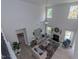 Spacious living room with high ceilings, fireplace, and ample natural light at 591 Glenkirk Pl # 106, Garner, NC 27529