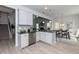 Modern kitchen with white cabinets, granite countertops, and stainless steel appliances at 591 Glenkirk Pl # 106, Garner, NC 27529