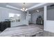 Home office with hardwood floors and a view of the entryway at 591 Glenkirk Pl # 106, Garner, NC 27529