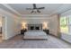 Main bedroom with plush carpeting and ceiling fan at 591 Glenkirk Pl # 106, Garner, NC 27529