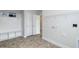 Laundry room with built-in shelving and bench at 591 Glenkirk Pl # 106, Garner, NC 27529