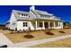 Two story home with a red door and white siding at 591 Glenkirk Pl # 106, Garner, NC 27529