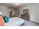 Spacious bedroom with plush carpet and built-in dresser at 591 Glenkirk Pl # 106, Garner, NC 27529