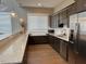 Community kitchen with stainless steel appliances and granite counters at 591 Glenkirk Pl # 106, Garner, NC 27529