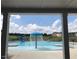 Community pool with water features and a slide at 591 Glenkirk Pl # 106, Garner, NC 27529