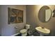 Small bathroom with pedestal sink, toilet and decorative wall art at 2001 Puffin Dr # 201, Haw River, NC 27258