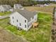 Aerial view showcasing the home's exterior, deck and backyard at 122 Whimbrel Ct, Lillington, NC 27546