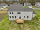 Aerial view highlighting the home's exterior, deck and backyard at 122 Whimbrel Ct, Lillington, NC 27546