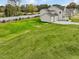 Large backyard with grassy area, providing plenty of outdoor space at 122 Whimbrel Ct, Lillington, NC 27546