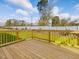 Wooden deck overlooking backyard with fenced yard at 122 Whimbrel Ct, Lillington, NC 27546
