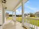 Spacious front porch overlooking the neighborhood at 122 Whimbrel Ct, Lillington, NC 27546