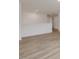 Bright hallway with hardwood floors and access to other rooms at 122 Whimbrel Ct, Lillington, NC 27546