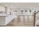 Open kitchen with island and stainless steel appliances at 122 Whimbrel Ct, Lillington, NC 27546