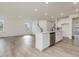Open concept kitchen with island and stainless steel appliances at 122 Whimbrel Ct, Lillington, NC 27546