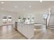 Open concept kitchen with large island and stainless steel appliances at 122 Whimbrel Ct, Lillington, NC 27546