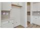 White kitchen cabinets and gray backsplash with a spacious pantry at 122 Whimbrel Ct, Lillington, NC 27546