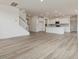 Open concept kitchen with island, white cabinets, and stainless steel appliances at 122 Whimbrel Ct, Lillington, NC 27546