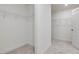 Spacious walk-in closet with double hanging rods and neutral carpet at 122 Whimbrel Ct, Lillington, NC 27546