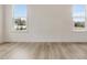 Spacious living room with hardwood floors and large windows at 122 Whimbrel Ct, Lillington, NC 27546