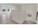 Spacious loft area with hardwood floors and large windows at 122 Whimbrel Ct, Lillington, NC 27546