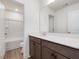 Modern bathroom with vanity, large mirror, and tub shower combo at 122 Whimbrel Ct, Lillington, NC 27546