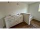 Bathroom featuring a double vanity and a soaking tub at 199 Grand Griffon Way, Lillington, NC 27546