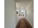 Clean and bright hallway with tile floors and doors to other rooms at 199 Grand Griffon Way, Lillington, NC 27546