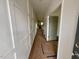 Bright hallway with wainscoting and views to kitchen at 199 Grand Griffon Way, Lillington, NC 27546