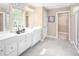 Elegant bathroom with double vanity, walk-in shower, and large closet at 313 Mason Oaks Dr, Wake Forest, NC 27587