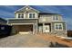 Two-story house with gray siding, stone accents, and a two-car garage at 499 Glenkirk Pl # 101, Garner, NC 27529