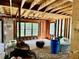 Unfinished interior room with exposed framing and large windows at 255 Roberts Ave, Henderson, NC 27537