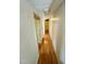 Long hallway with laminate flooring and light-colored walls at 255 Roberts Ave, Henderson, NC 27537