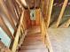 Unfinished wooden staircase leading to the upper level at 255 Roberts Ave, Henderson, NC 27537