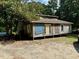 Rustic one-story home with wooden siding needing some repairs at 255 Roberts Ave, Henderson, NC 27537