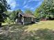 Rustic one-story home with wooden siding needing some repairs at 255 Roberts Ave, Henderson, NC 27537