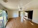 Bright living room featuring laminate wood flooring and access to the outdoors at 255 Roberts Ave, Henderson, NC 27537
