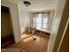 Bedroom with wood flooring, window seat, and built-in shelving at 255 Roberts Ave, Henderson, NC 27537