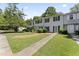 Townhouse exterior with landscaping and walkway at 15 Providence Ct, Durham, NC 27705
