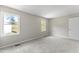 Well-lit bedroom, featuring neutral walls and carpet at 15 Providence Ct, Durham, NC 27705