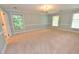 Spacious bedroom with light blue walls and neutral carpet at 204 Candlewood Rd, Rocky Mount, NC 27804