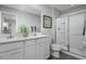 Bathroom with double vanity, shower and white cabinets at 188 Day Farm Dr, Lillington, NC 27546