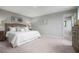 Spacious main bedroom with carpeted floors and ensuite bathroom at 188 Day Farm Dr, Lillington, NC 27546