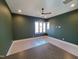 Spacious bedroom with dark green walls and large window at 7640 Falls Creek Ln, Raleigh, NC 27614