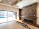 Modern fireplace with stone surround and wooden mantel at 7640 Falls Creek Ln, Raleigh, NC 27614