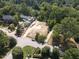 Aerial view of vacant lot, under construction home, and surrounding area at 401 Marlowe Rd, Raleigh, NC 27609