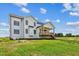 Rear view of farmhouse with large deck at 3408 Apple Meadow Dr, Fuquay Varina, NC 27526