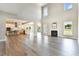 Open concept living room with high ceilings, hardwood floors and fireplace at 3408 Apple Meadow Dr, Fuquay Varina, NC 27526