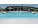 Large community swimming pool with plenty of lounge chairs at 517 Still Willow Ln, Wendell, NC 27591