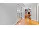 Hardwood floor hallway with French doors leading to kitchen and living room at 120 Rosewall Ln, Cary, NC 27511